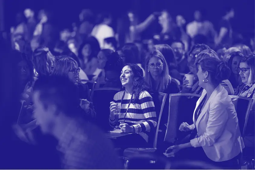 A colorful abstract design featuring the word 'hi' prominently displayed in gradient shades of pink and purple. The Workhuman logo is positioned in the top left corner of the image. The background has a soft, swirling texture that enhances the vibrant colors of the text.