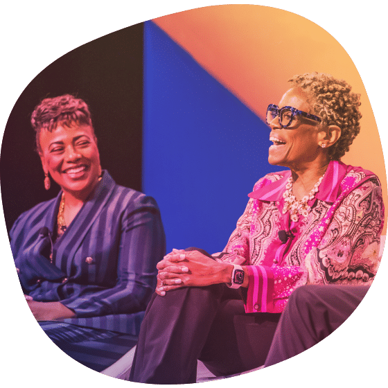 Panel speakers laughing with one another