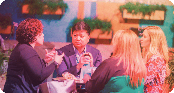 small group of executives talking in a lounge area