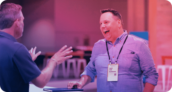 Two professionals networking at the Executive Forum