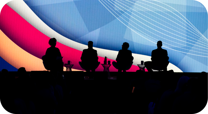 Silhouetted speakers on the main stage at Workhuman Live